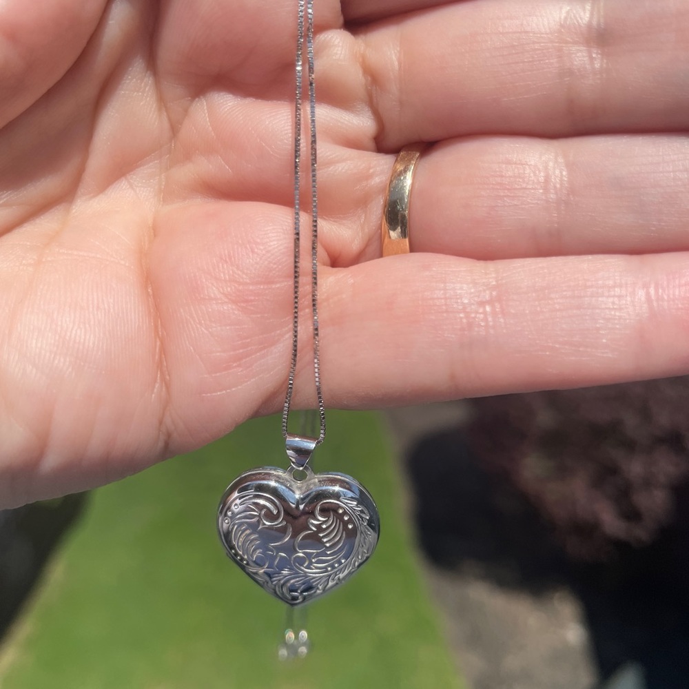 Silver locket necklace.